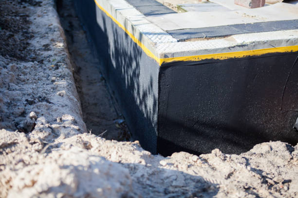 Professional Basement Waterproofing technician working in The Plains, OH